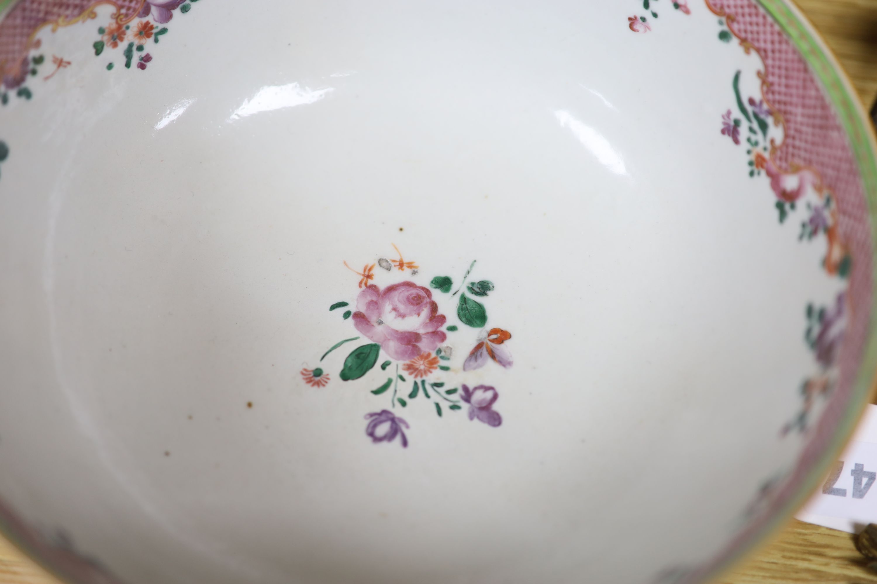 A Chinese pink ground bowl, late 19th century together with two other bowls, a famille verte dish and a plate